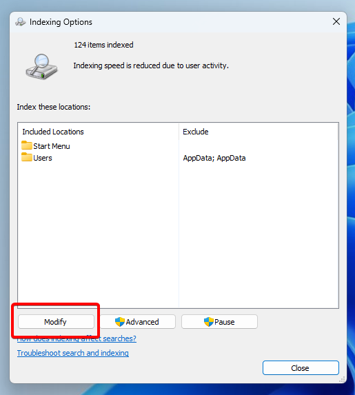 Screenshot of the Indexing Options window with the modify button highlighted.